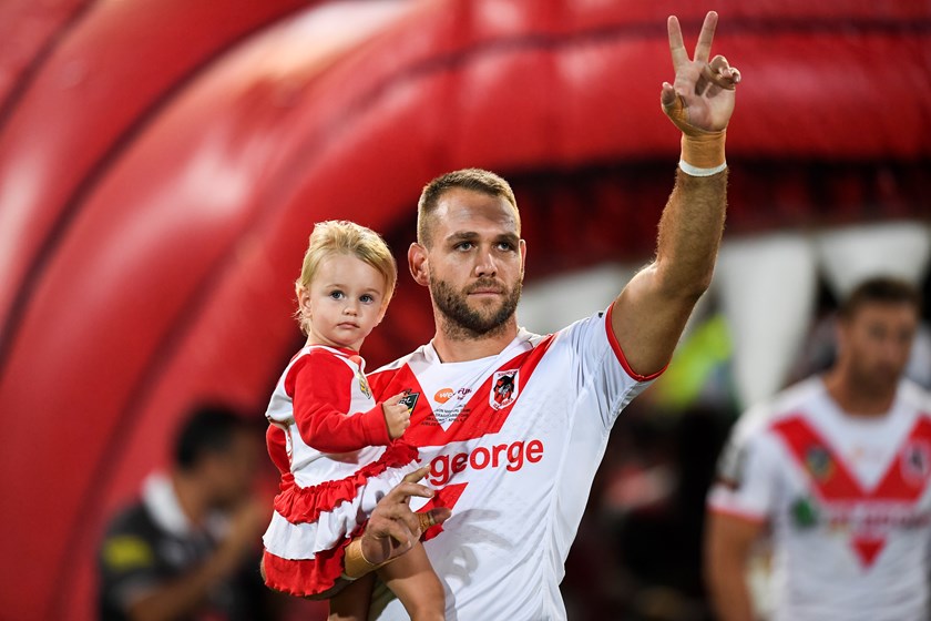 Jason Nightingale leads the boys out for his 250th game with daughter Chloe earlier this season.