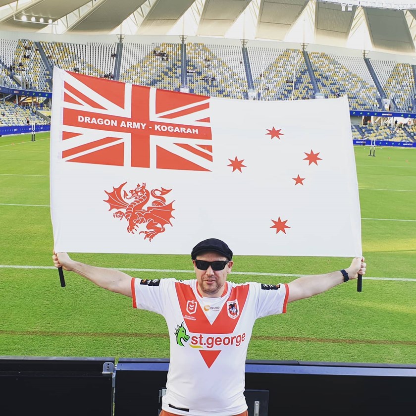 Matthew proudly waving his Dragons banner in North Queensland