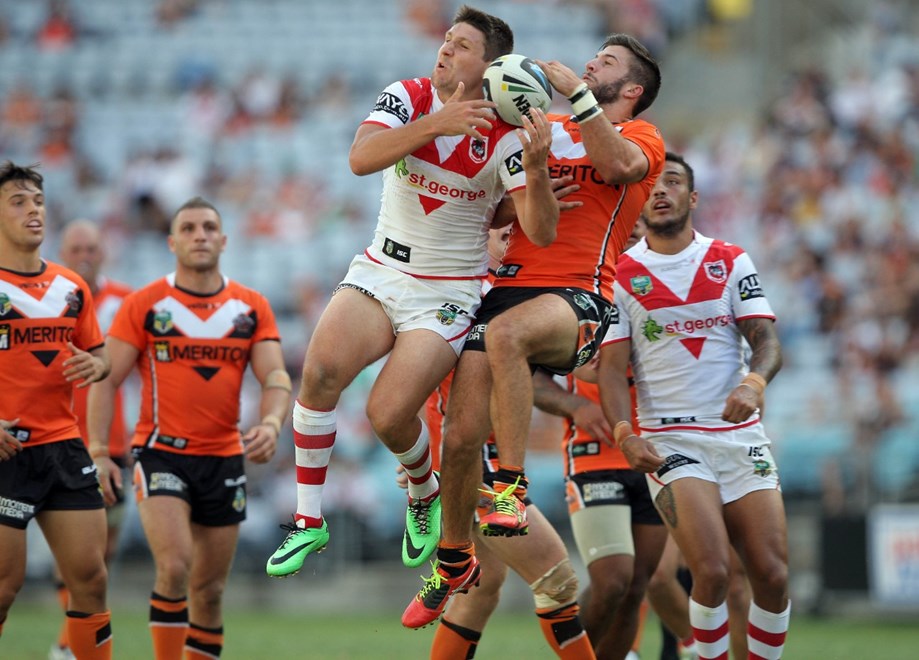 Gareth Widdop and James Tedesco go for a high ball : NRL Rugby League - Round 1 - St.George-Illawarra Dragons V Wests Tigers at ANZ Stadium, Sunday the 9th of March 2014. Digital Image by Robb Cox nrlphotos.com