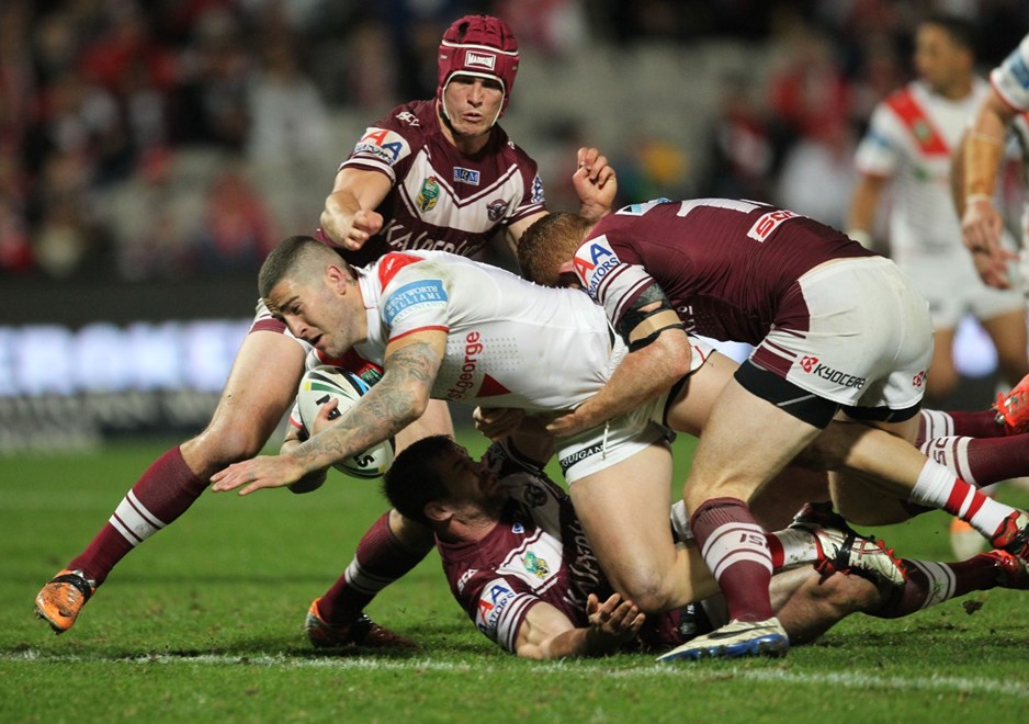 .Photo by Colin Whelan copyright © nrlphotos.com :     Joel Thompson brought down with Matt Ballin at top and Tom Symonds                          NRL Rugby League, Round 19 St George Illawarra Dragons v Manly Warringah Sea Eagles at Win Jubilee, Monday July 21st 2014.