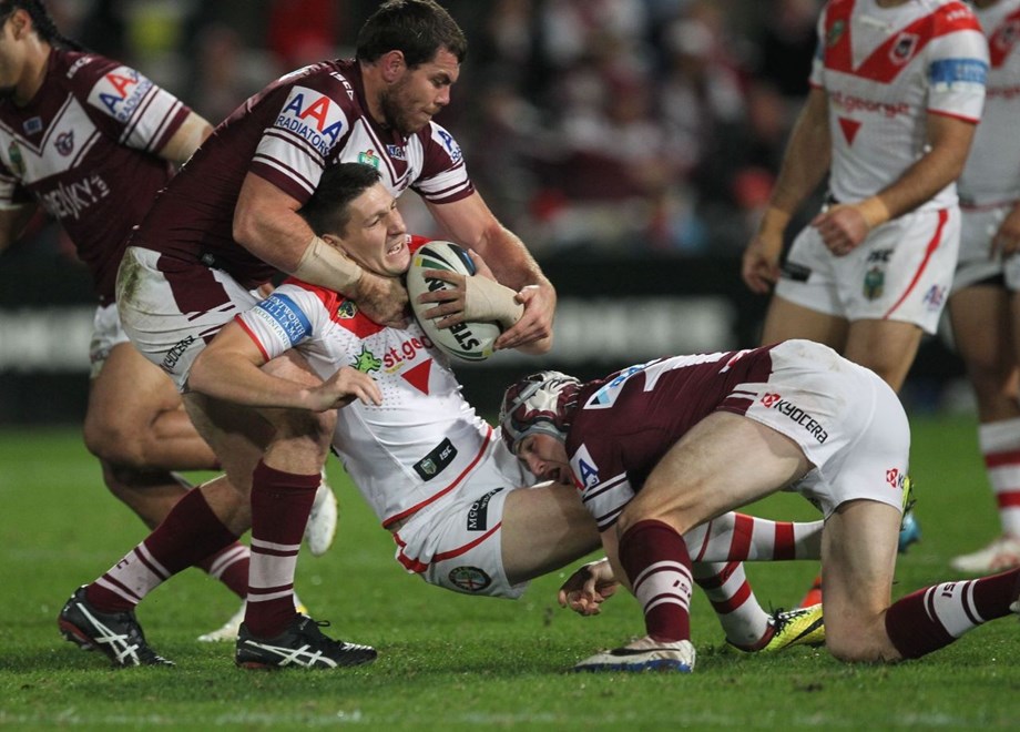 .Photo by Colin Whelan copyright © nrlphotos.com :      Gareth Widdop held by Josh Starling and Jamie Buhrer                         NRL Rugby League, Round 19 St George Illawarra Dragons v Manly Warringah Sea Eagles at Win Jubilee, Monday July 21st 2014.