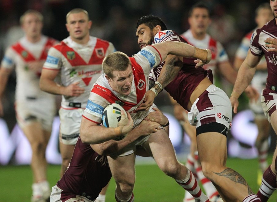 .Photo by Colin Whelan copyright © nrlphotos.com :      Ben Creagh pulled down with Jesse Fene-Lefao                         NRL Rugby League, Round 19 St George Illawarra Dragons v Manly Warringah Sea Eagles at Win Jubilee, Monday July 21st 2014.