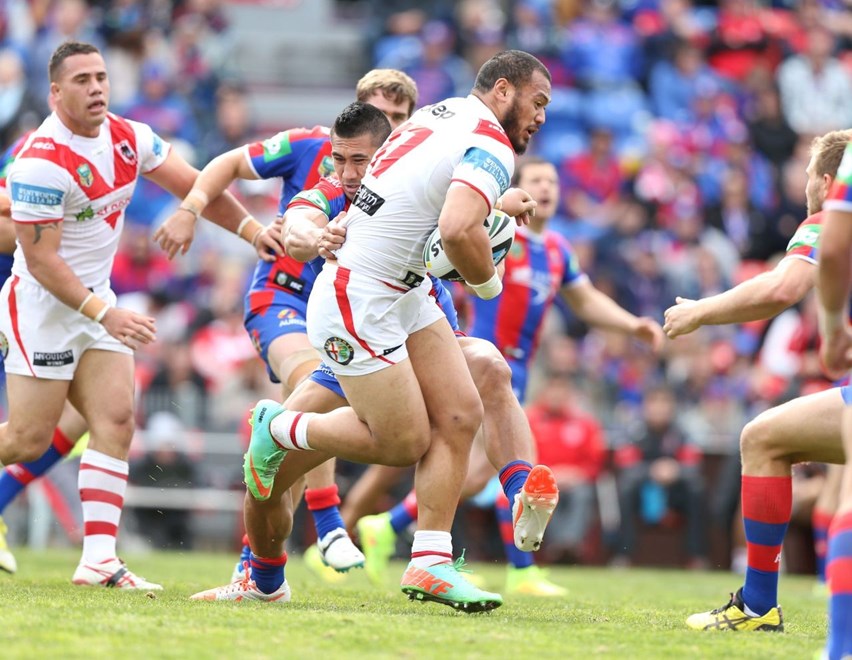 Photo by Anthony Johnson copyright Â© nrlphotos.com: Leeson Ah Mau getting tackled.  NRL Rugby League, Round 26, Newcastle Knights v St George Illawarra Dragons at Hunter Stadium, Newcastle. Sunday September 7th, 2014