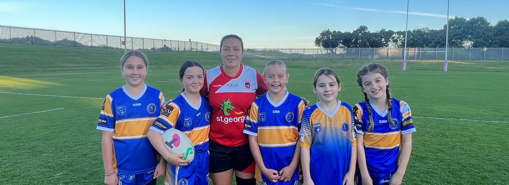 Raecene McGregor pictured with the Bomaderry Swamprats under-10s league tag team.