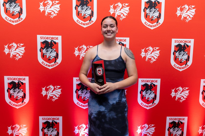 Alexis Tauaneai photographed with the Dragons NRLW Coach's Award.