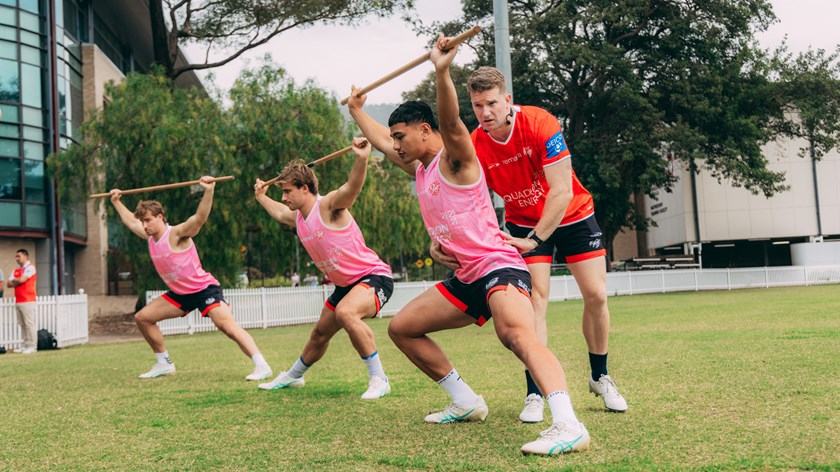 Strength and Power Coach Nathan Spencer assisting players through an exercise.