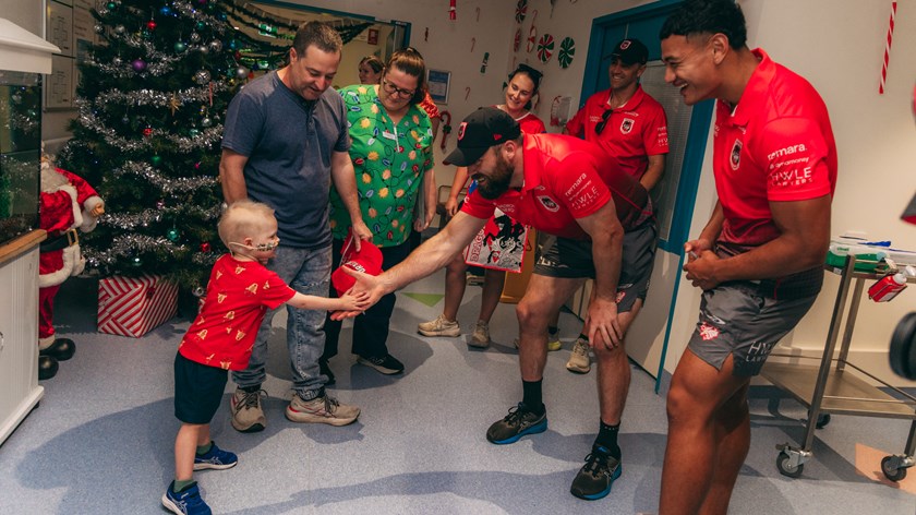 Tom Eisenhuth & Sione Finau meet a young fan.