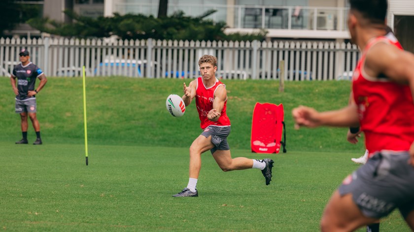 Kyan Hjaltason moves the ball on.