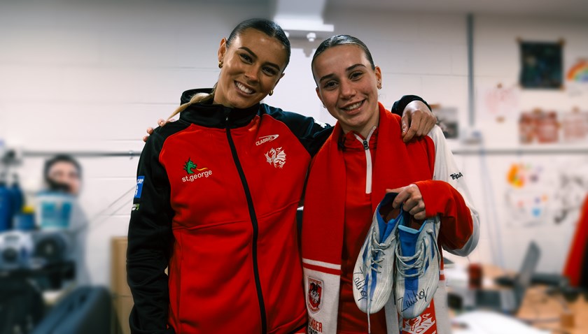 Alyssa Biasotto poses with NRLW star Zali Hopkins and her new pair of signed boots.