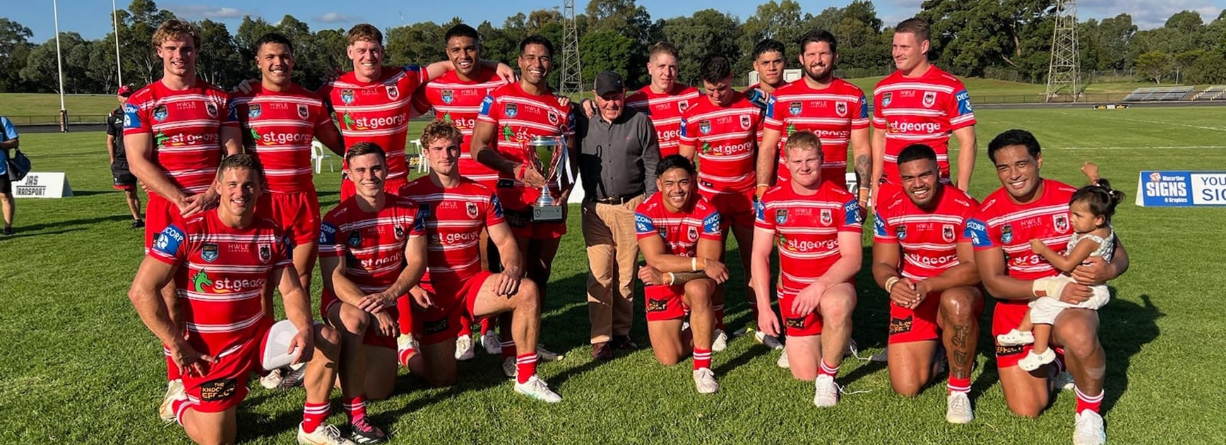 The Dragons Knock On Effect Cup side with Roy Masters after retaining the Roy Masters Cup. 