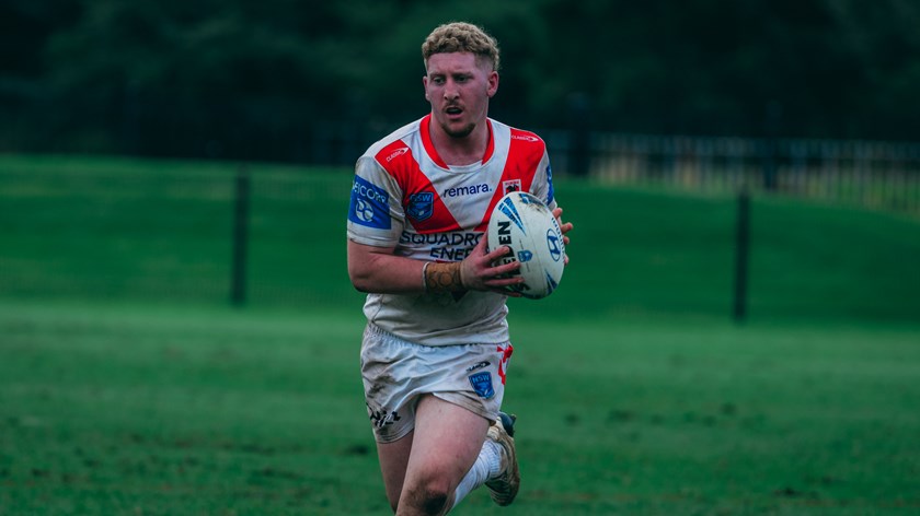 Ryan Hutchinson with the ball in two hands.