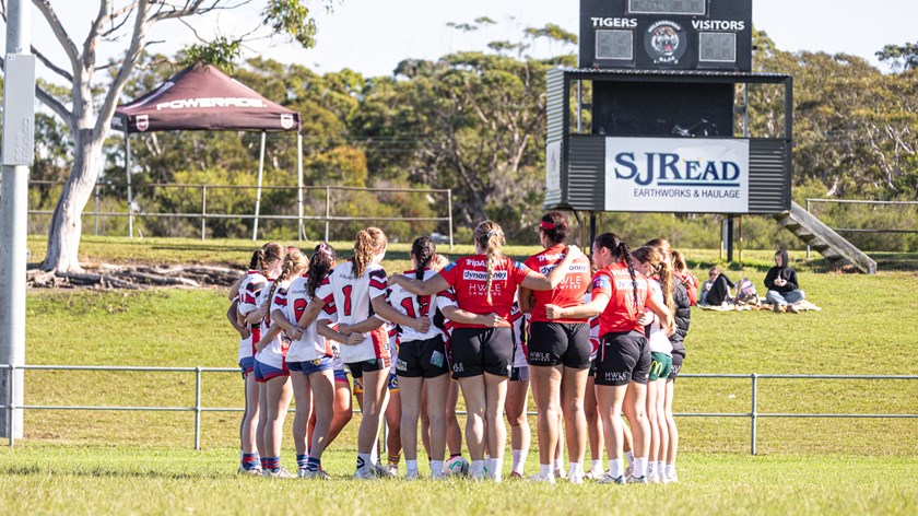 Members of the club’s NRLW huddle alongside the Academy triallists.